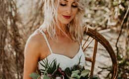 Bride admiring her bouquet