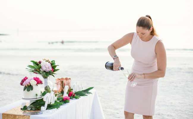 wedding planner pouring champagne