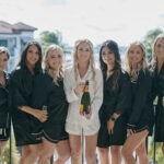 Bride and Bridesmaids getting ready with champagne at Naples Bay Resort