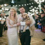 Bride and Groom sparkler exit with puppy at Naples Bay Resort