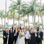 Excited wedding party with bride and groom at private estate in Naples, FL