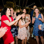 Guests clapping and grooving on the dance floor at private estate in Naples, FL