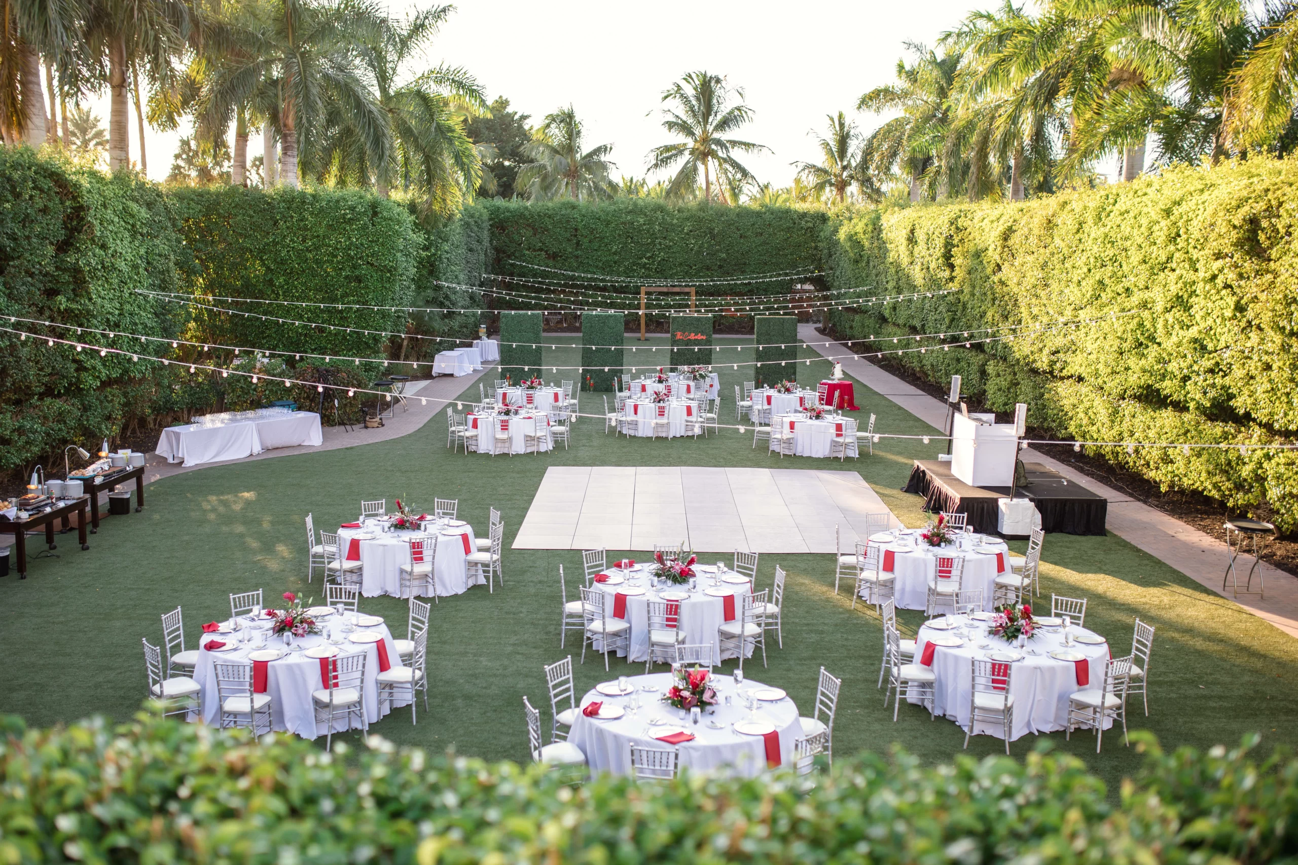 Full view of reception with ceremony behind hedge walls at The Hyatt Regency Coconut Point in Bonita Springs, FL